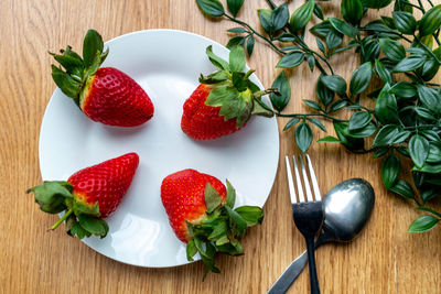 High angle view of strawberries on table