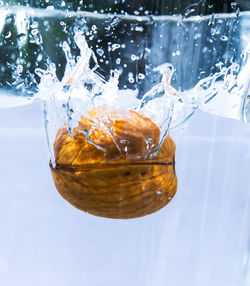 Close-up of water splashing in glass