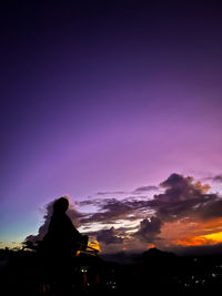 Low angle view of silhouette trees against sky during sunset