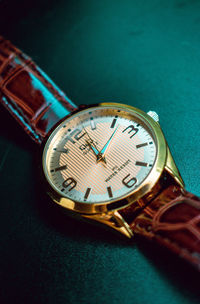 High angle view of clock on table