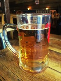 Close-up of beer glass on table