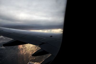 Airplane wing against sky