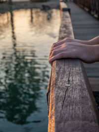 Cropped hands on railing