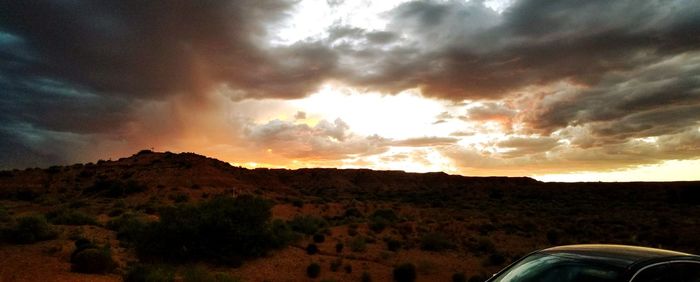 Scenic view of landscape against sky during sunset