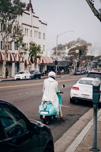 Rear view of man on city street