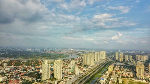 High angle view of city buildings against sky