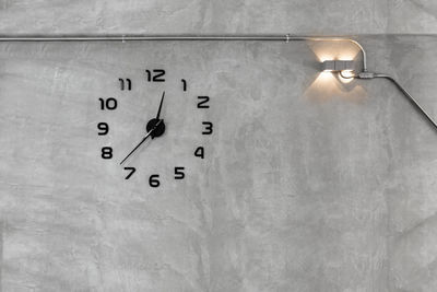 Close-up of clock on wall