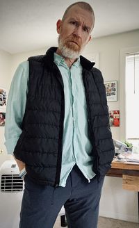 Portrait of man standing at home