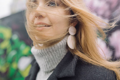 Close-up portrait of woman in winter