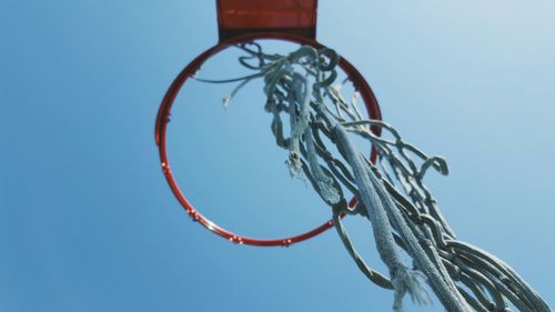 Low angle view of basketball hoop against clear sky
