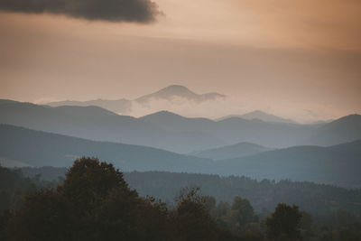 Scenic view of mountains against sky during sunset