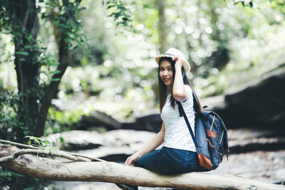 Woman sitting in a forest