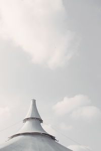 Low angle view of airplane flying against sky