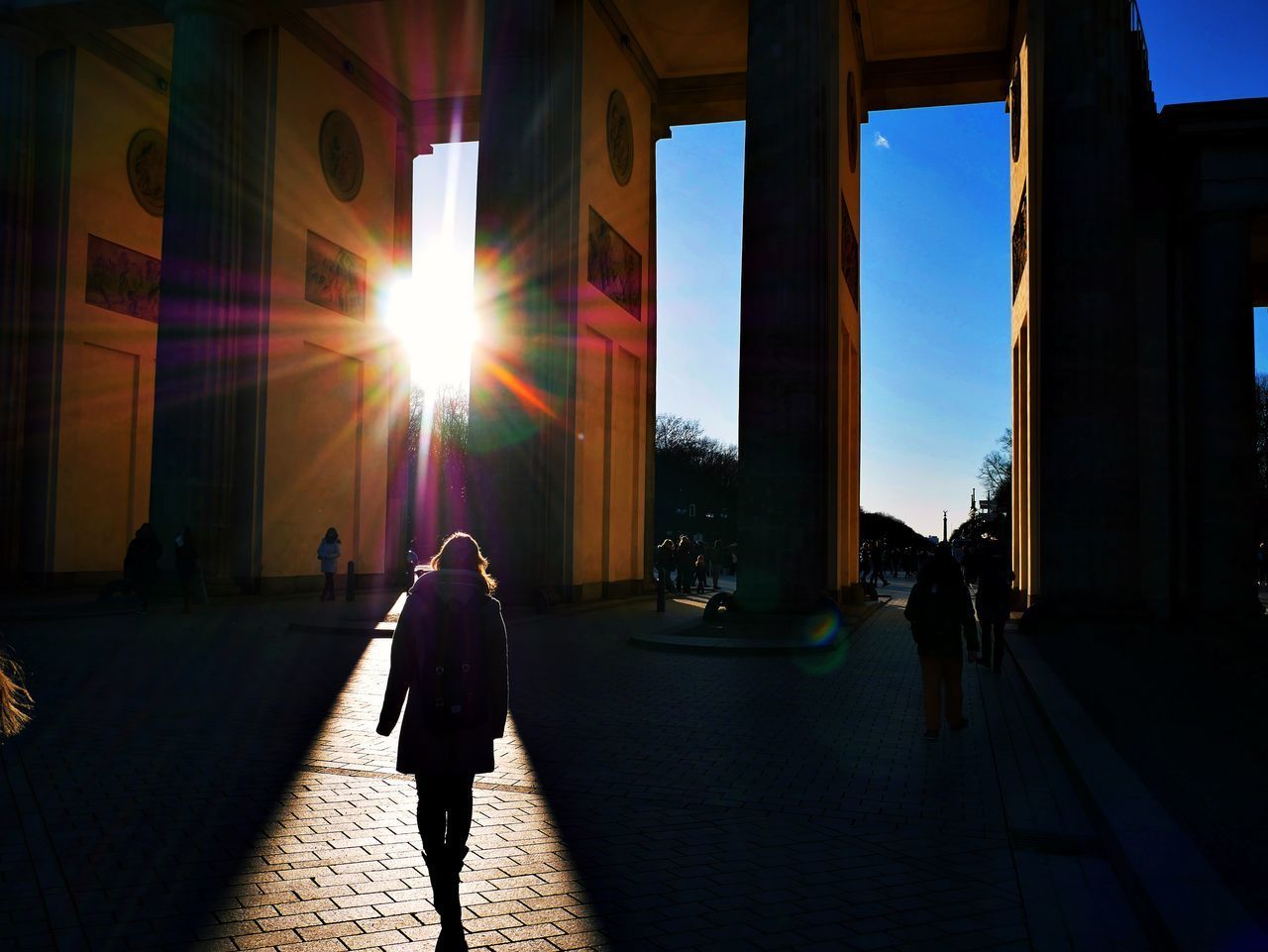 SILHOUETTE OF PEOPLE WALKING ON STREET