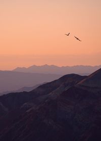 Scenic view of mountains against sky during sunset