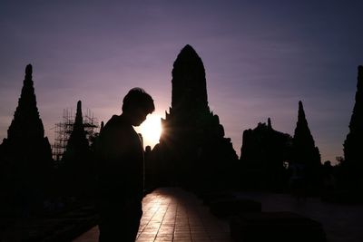 Silhouette of temple against sky during sunset