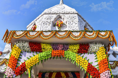 Gate of a temple of india decorated by flower