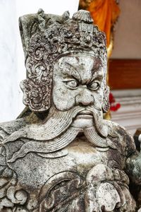 Close-up of statue against temple