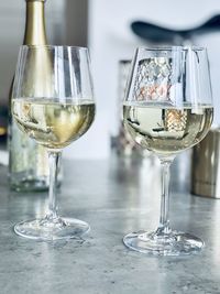 Close-up of wine glasses on table