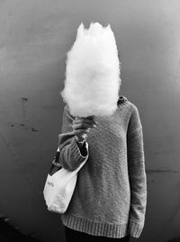 Person holding ice cream standing outdoors