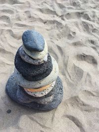 High angle view of stack on sand