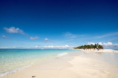 View of beach against blue sky