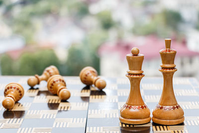 Close-up of chess pieces on table