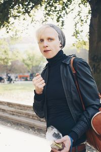 Portrait of teenage boy standing outdoors