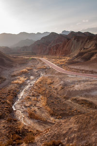 Scenic view of arid landscape against sky