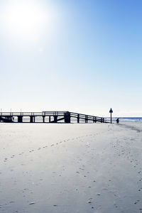 Scenic view of beach against clear sky