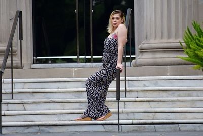 Young woman on staircase