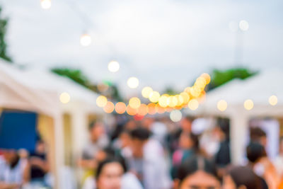 Close-up of people at night