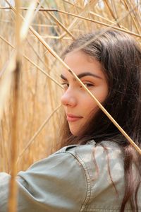 Portrait of teenage girl amidst plants