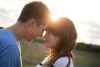 Side view of young couple outdoors