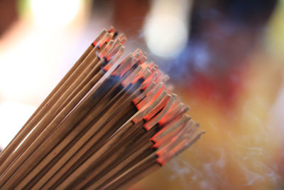 Close-up of burning incense sticks