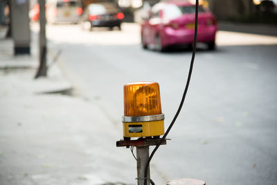 Close-up of lighting equipment by road