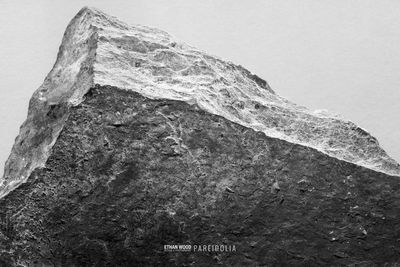 Low angle view of rock against sky