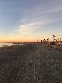 Scenic view of beach against sky during sunset