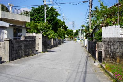 Street amidst buildings against sky