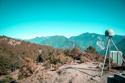 Scenic view of mountains against clear blue sky