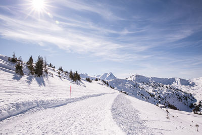 Scenic view of snow covered mountains against sky