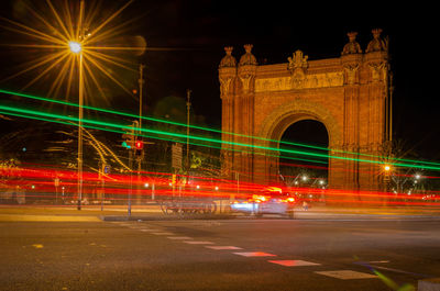 Illuminated bridge at night