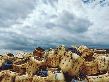 Stack of rocks on beach against sky