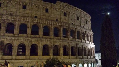 Low angle view of historical building at night