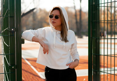 Young woman wearing sunglasses standing outdoors