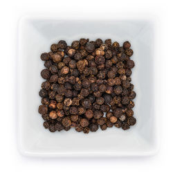 High angle view of coffee beans against white background