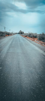 Road amidst snow against sky