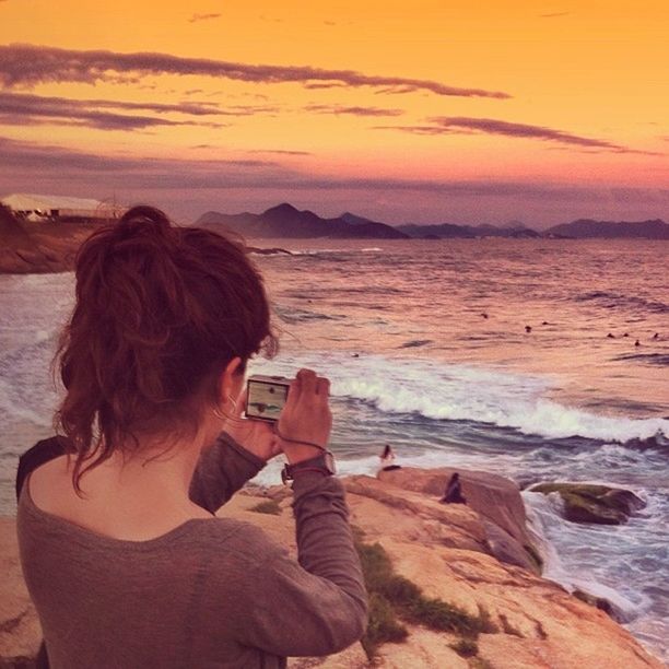 sea, lifestyles, beach, water, leisure activity, sunset, sky, horizon over water, shore, scenics, vacations, standing, beauty in nature, tranquil scene, person, sand, nature, young women