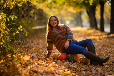 Young woman sitting on field