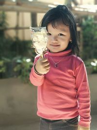 Portrait of smiling girl holding ice cream